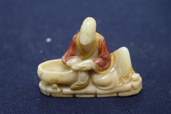 A Chinese jade plaque and a soapstone figure